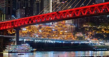 CHONGQING, CHINA - APRIL 30: Tourists visit Jiangbeizui Jiangtan Park under Qiansimen Jialing River Bridge ahead of the May Day holiday on April 30, 2025 in Chongqing, China. The five-day May Day holiday will start on May 1 this year. (Photo by Fuyu Jianglin/VCG via Getty Images)