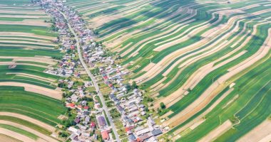 Aerial view of Suloszowa village in Poland, surrounded by agricultural fields.