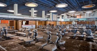 Abandoned airport waiting area with dirty seats.