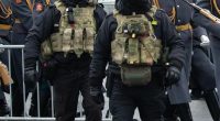 Federal security service officers at a funeral ceremony.