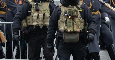 Federal security service officers at a funeral ceremony.