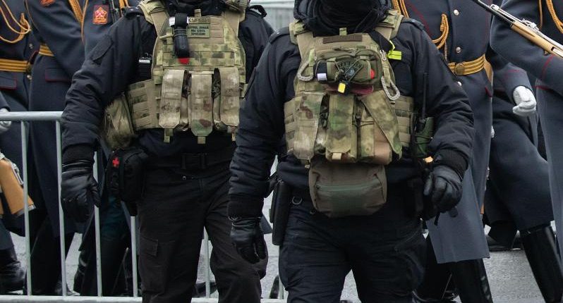 Federal security service officers at a funeral ceremony.