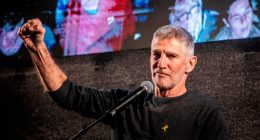 Yair Golan raises a clenched right fist