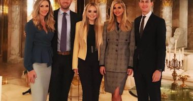 Ivanka Trump, Tiffany Trump, Eric Trump, and two other people posing for a photo.