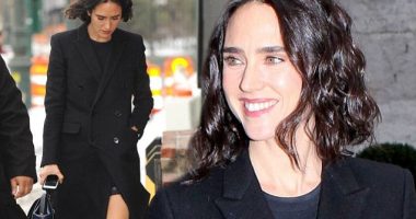 Jennifer Connelly flashes her trim pins in black wool coat and sandals