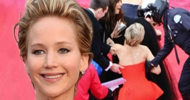 Jennifer Lawrence repeats last year's Oscars fall as she trips on gown