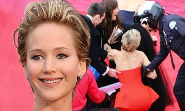 Jennifer Lawrence repeats last year's Oscars fall as she trips on gown