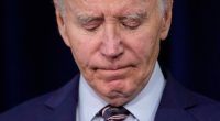 Close-up of President Biden appearing somber.