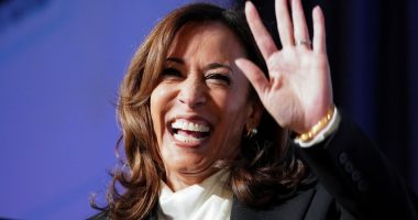 Kamala Harris waving and smiling.