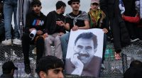 Kurdish youths with a poster of jailed PKK leader Abdullah Öcalan in Diyarbakir, south-eastern Turkey, in March