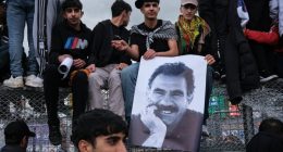 Kurdish youths with a poster of jailed PKK leader Abdullah Öcalan in Diyarbakir, south-eastern Turkey, in March