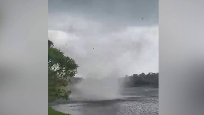 Lightning sparks house fire in Waterford Lakes, nearby resident captures waterspout on camera