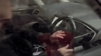 Person driving a car.