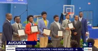 Local middle school boys graduate from mentoring program