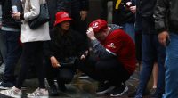Liverpool fans reacting to an incident at a victory parade.