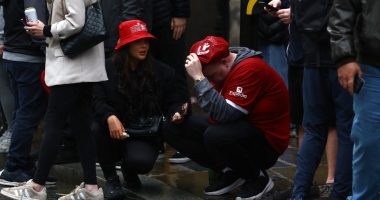 Liverpool fans reacting to an incident at a victory parade.