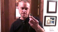 A screenshot of a video Tim Friede posted on YouTube 11 years ago of him being bitten by a taipan.