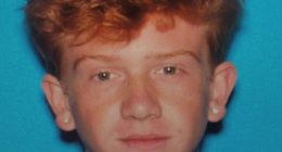 Mugshot of a young man with red hair.