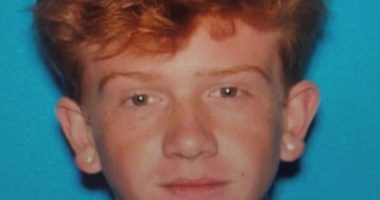Mugshot of a young man with red hair.