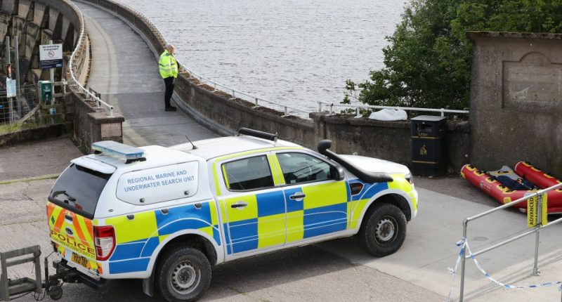 Police underwater search team at a reservoir.