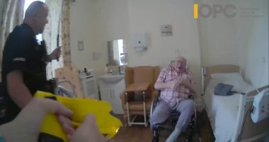 Bodycam footage of police officers using force against a 92-year-old man in a wheelchair.