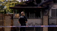 A nine-year-old boy is dead and a woman is under police guard after a suspicious house fire in Toowoomba, Queensland. ï»¿