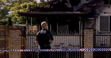 A nine-year-old boy is dead and a woman is under police guard after a suspicious house fire in Toowoomba, Queensland. ï»¿