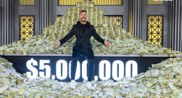Man sitting on a large pile of money; $5,000,000 displayed.