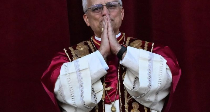 Pope Leo XIV appearing on a balcony.