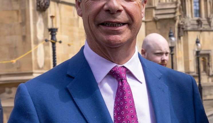 Nigel Farage and Sarah Pochin, Reform's first female MP, outside the Houses of Parliament.