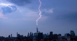 A lightning bolt strikes One World Trade Center during a thunderstorm in New York City on June 22, 2024, as seen from Jersey City, New Jersey. (Photo by Gary Hershorn/Getty Images)