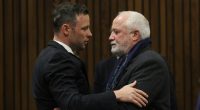 Oscar Pistorius embracing his father in court.