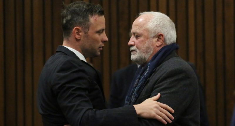 Oscar Pistorius embracing his father in court.