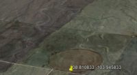 Aerial view of farmland with circular patterns.
