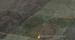 Aerial view of farmland with circular patterns.