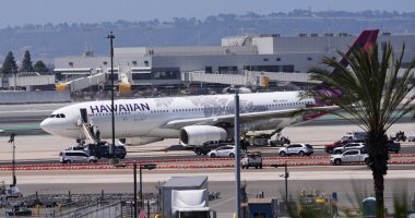 Hawaiian Airlines plane on tarmac after evacuation at San Diego International Airport.
