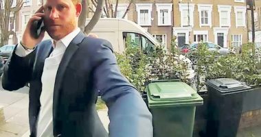 Prince Harry on a phone call, knocking on a door in Fulham.