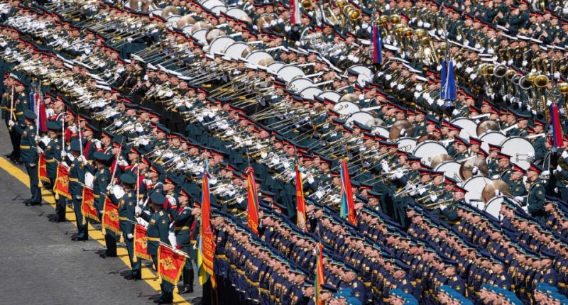 Military band playing in Red Square during a Victory Day parade.