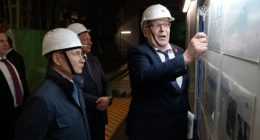 Vladimir Putin visiting a nuclear power plant under construction.