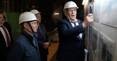 Vladimir Putin visiting a nuclear power plant under construction.