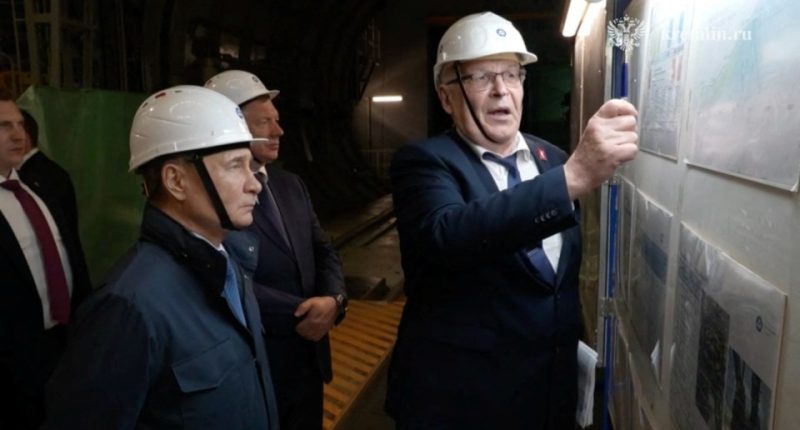 Vladimir Putin visiting a nuclear power plant under construction.