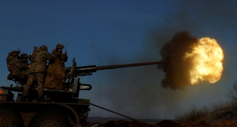 Ukrainian soldiers firing an anti-aircraft weapon in Bakhmut.