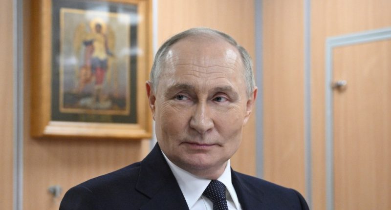 Vladimir Putin in a suit.