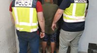 Police officers arresting a suspect.