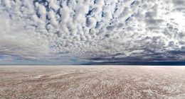 ï»¿Kati Thanda-Lake Eyre is a dry salt bed in the lowest point in Australia, sitting 15 metres below sea level, and covers about 9500 square kilometres.