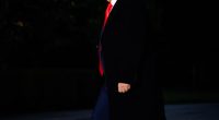 Donald Trump walking at night.