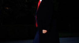 Donald Trump walking at night.