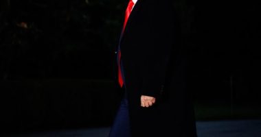 Donald Trump walking at night.