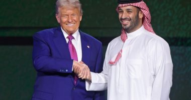 Donald Trump and Mohammed bin Salman shaking hands at an investment forum.