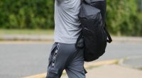 Prisoner giving the middle finger while leaving prison.